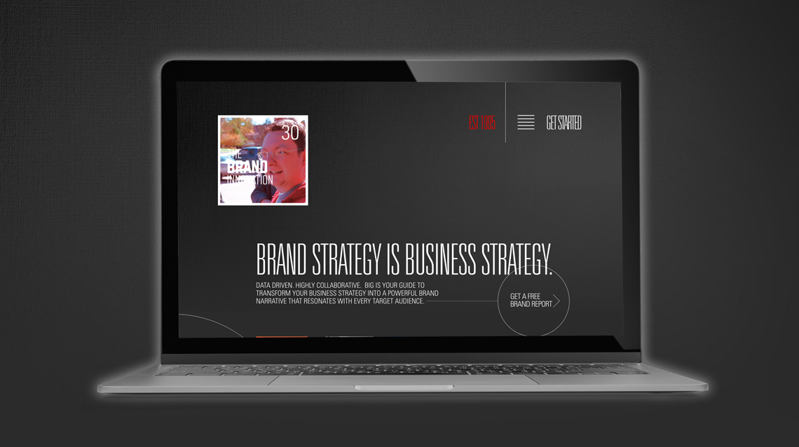 Brand Innovation Group website on a laptop